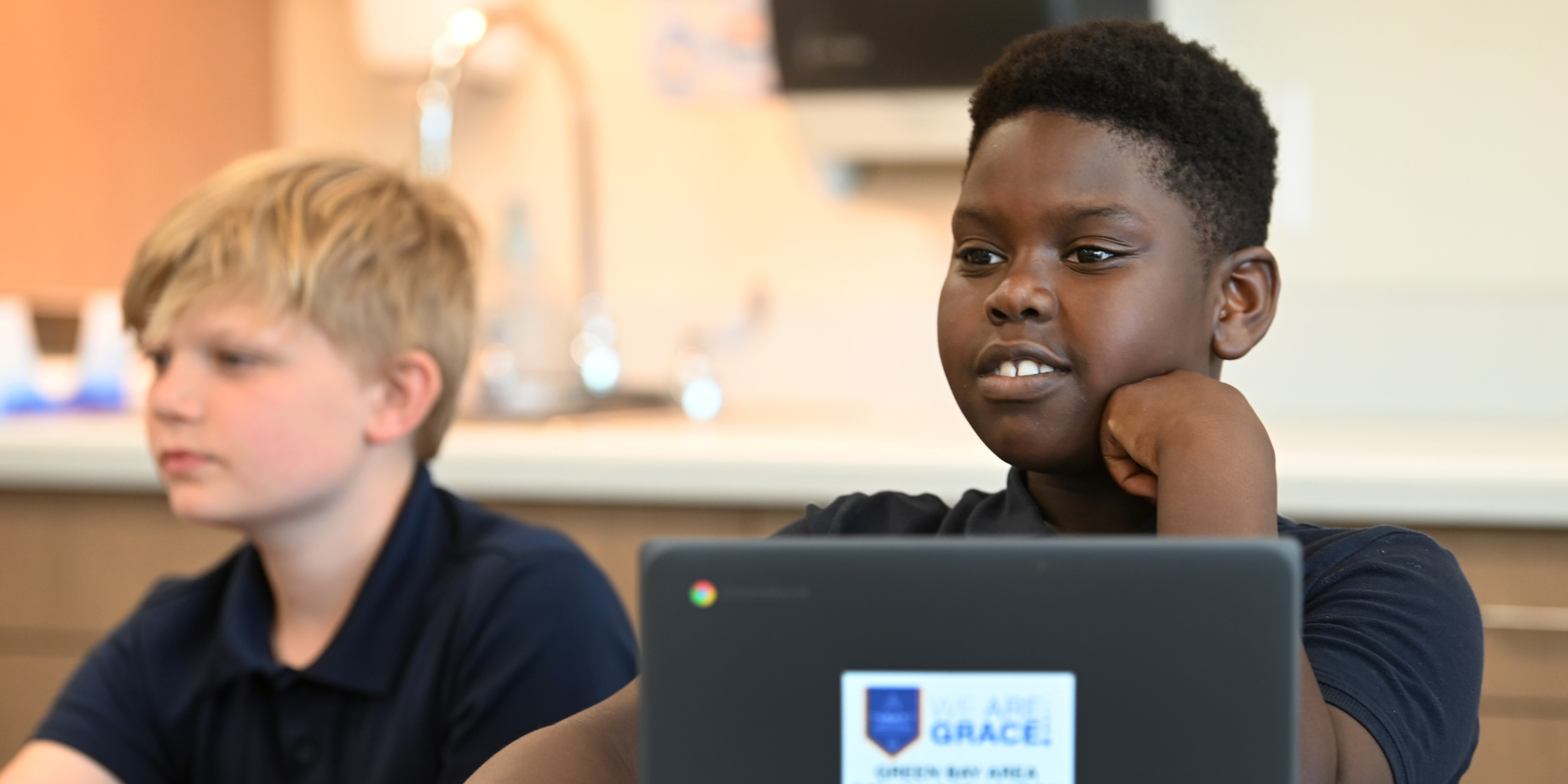 GRACE student on laptop in classroom