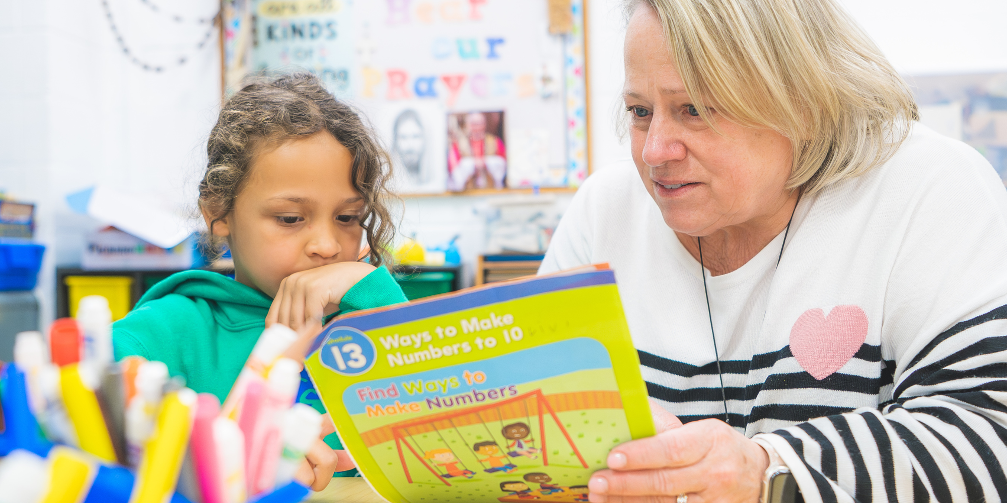 Father Allouez teacher with student